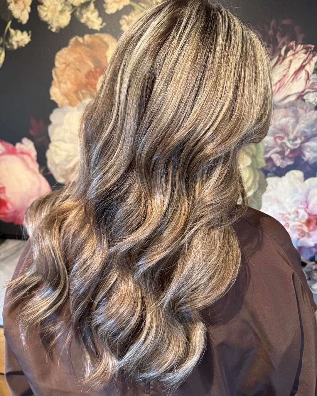 Sandy Bronde Perfection with Depth 

A refined blend of soft sandy blonde tones enriched with nuetral lowlights to create natural depth and seamless movement.
This customized color was crafted using Goldwell Professional Color for luminous, multi-ton