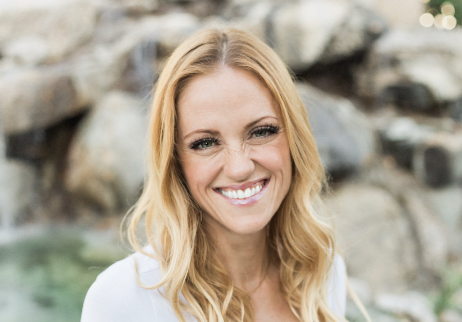 Head shot of Bria Gadd in white shirt smiling at camera