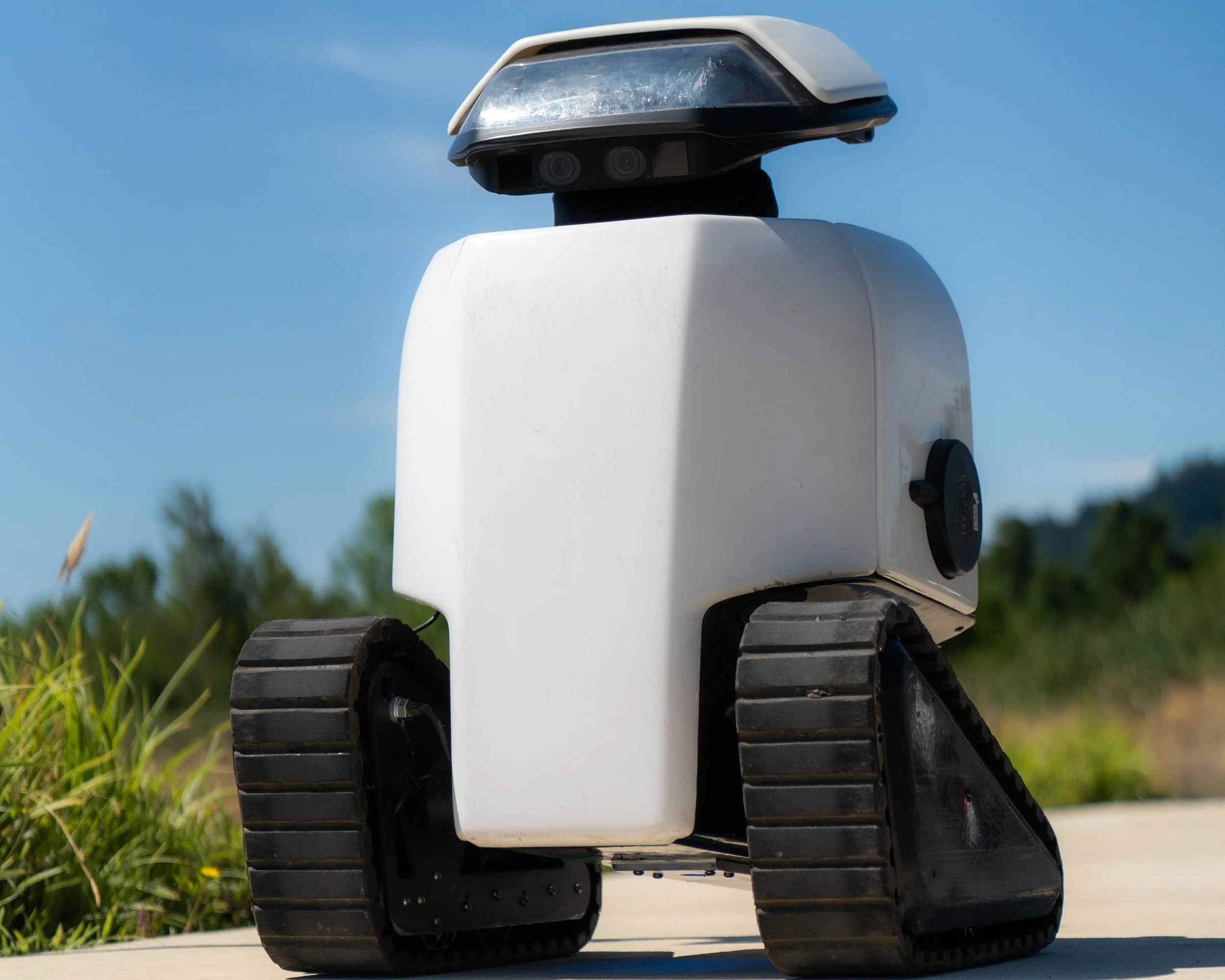 Dax sidewalk assessment robot rolls down sidewalk