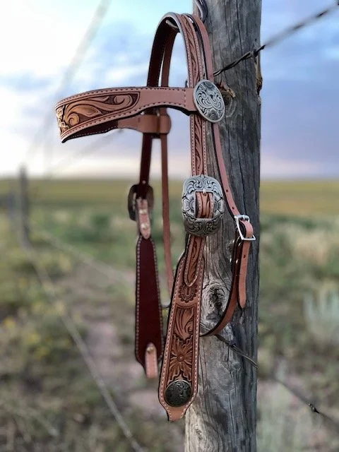 Floral tooled leather browband headstall perfect for a snaffle bit.  Hand made, veteran owned, small business.  Fully lined and stitched from Hermann Oak Leather.  White bronze buckles and conchos made from John Mincer.  