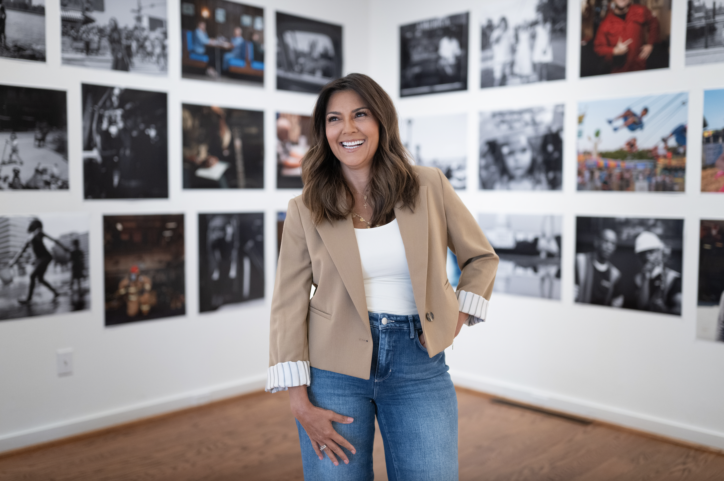 Rachel Campos-Duffy in front of Passport to Patriotism at the Art Museum of the Americas