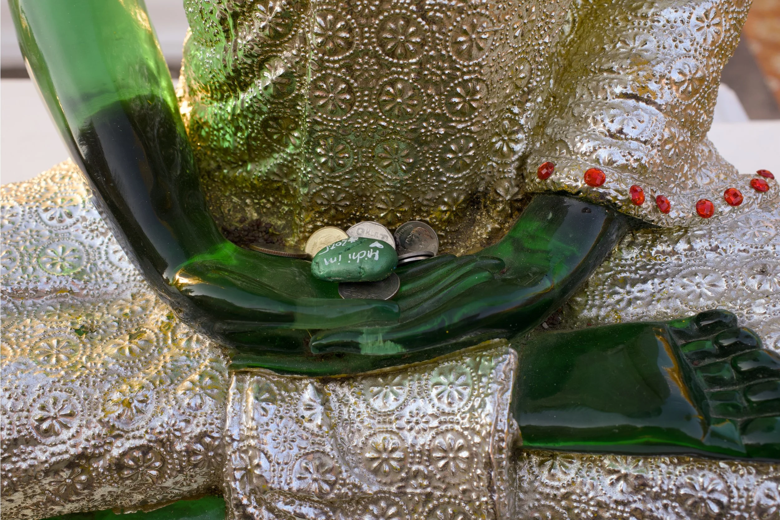 Green stone and hands.jpg