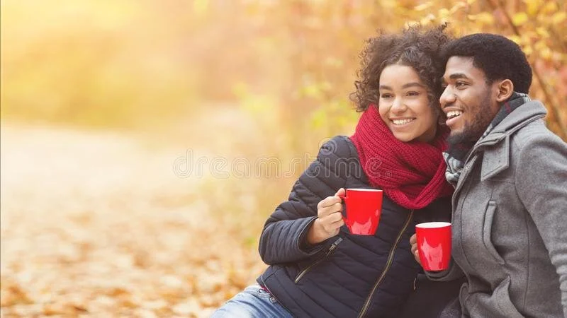 afro-couple-enjoying-picnic-time-park-afro-couple-enjoying-picnic-time-autumn-park-drinking-coffee-looking-aside-free-157485921.jpg