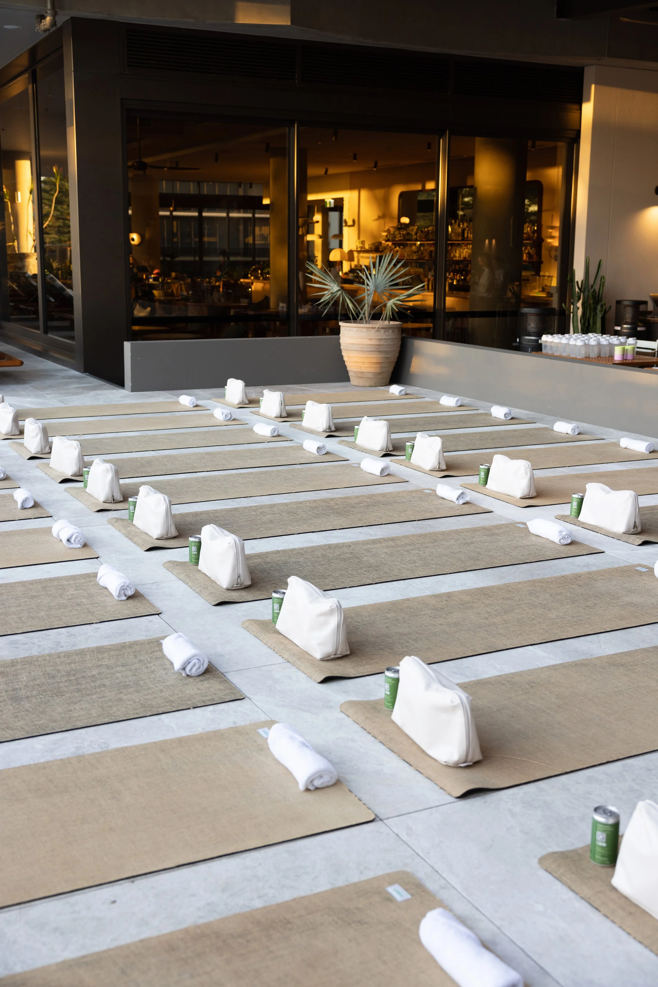 A beautifully prepared wellness retreat space with yoga mats and mindful styling, creating a calm and inviting atmosphere before guests arrive.