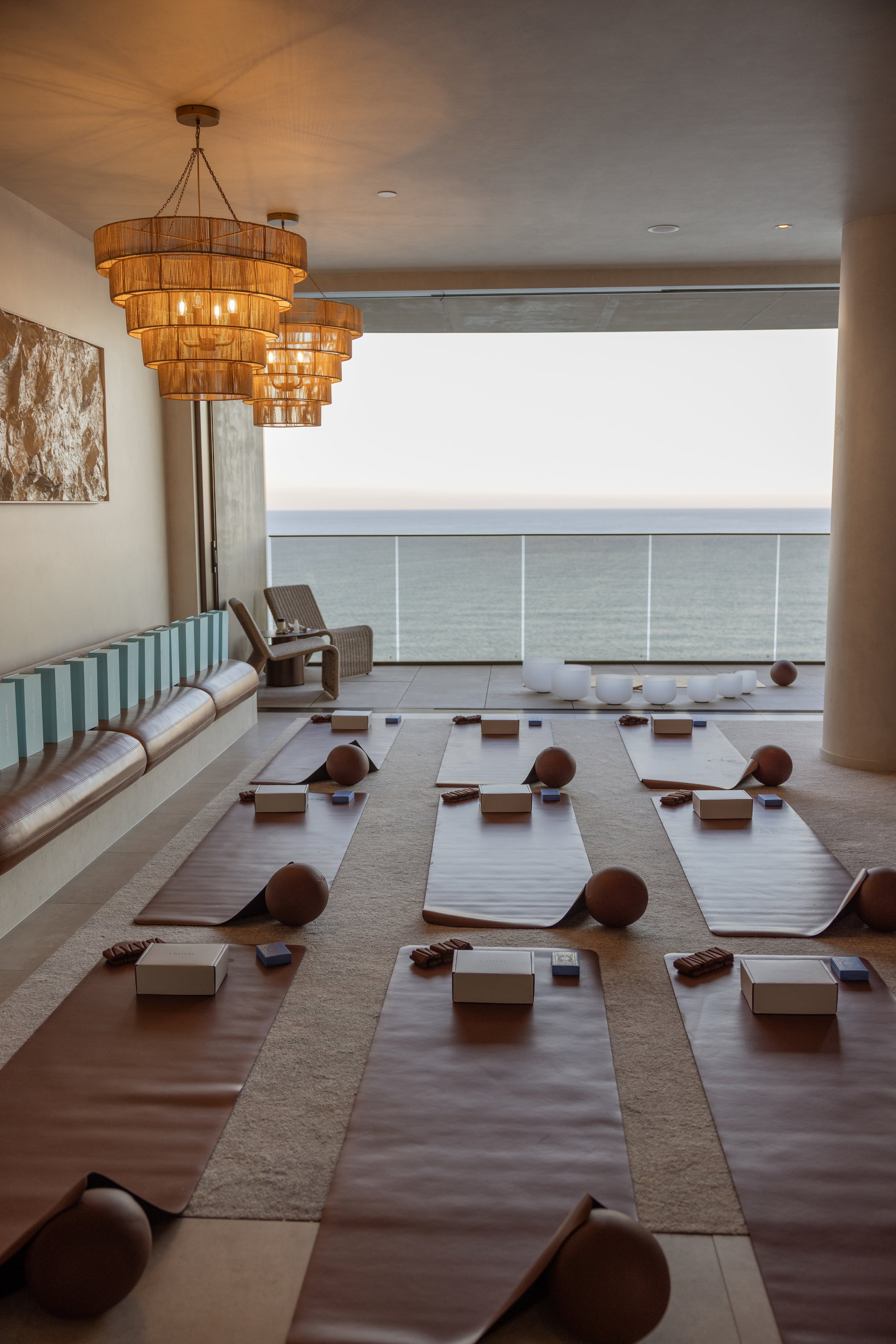 Editorial photography capturing the carefully curated setup of a luxury wellness event, highlighting the details that elevate the guest experience.