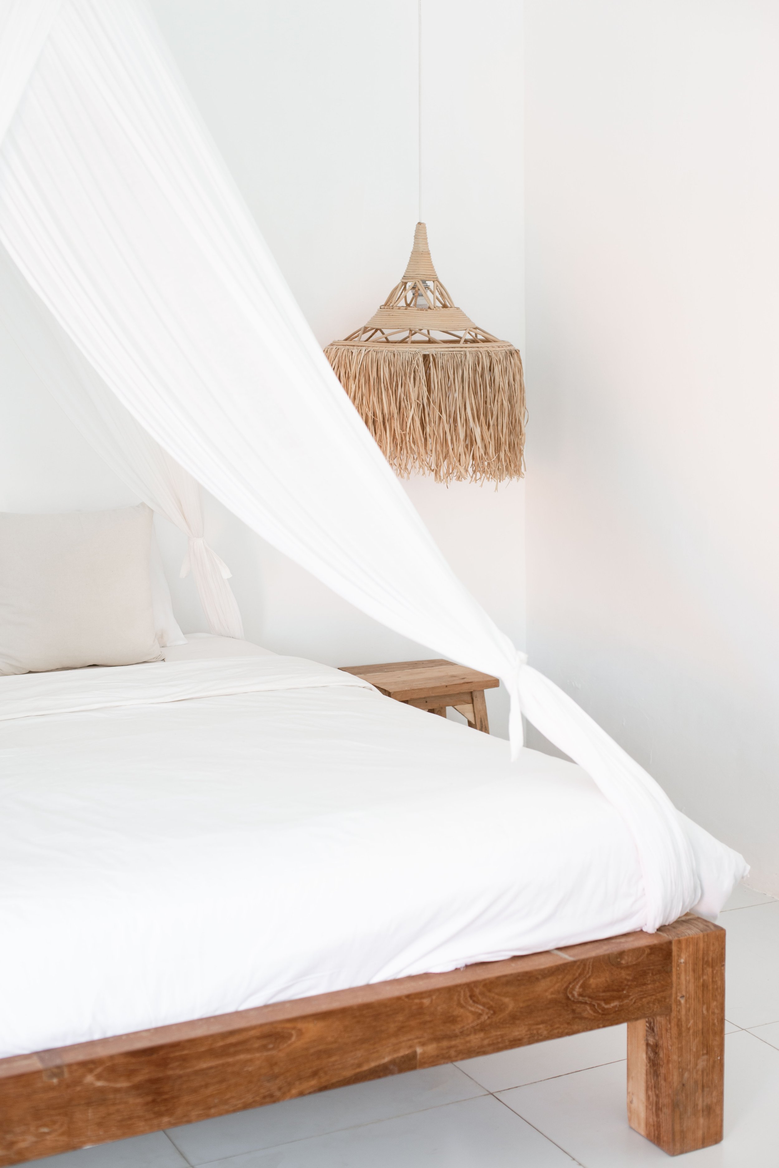 Editorial bedroom photography featuring linen textures and soft morning light in a boutique Airbnb.