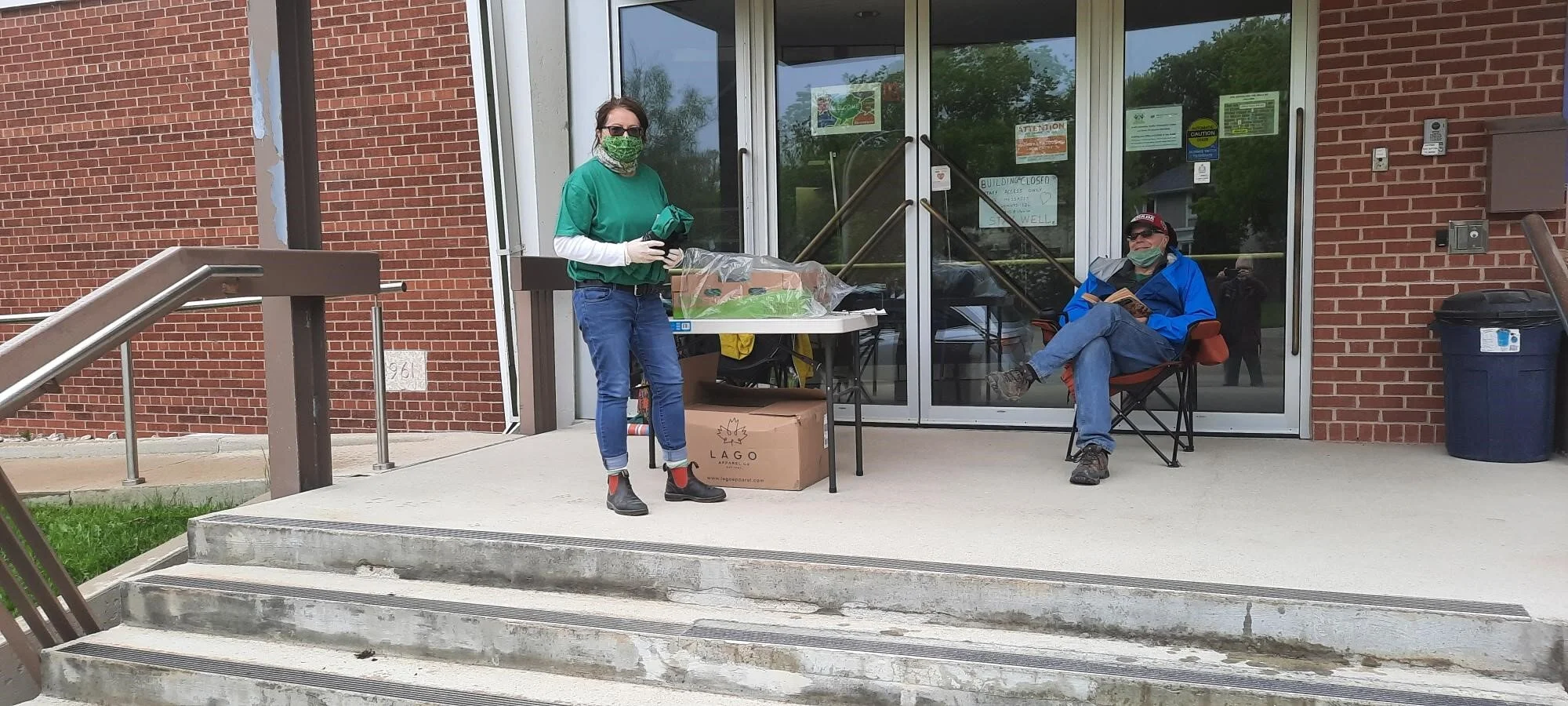 Handing out bags and shirts at the church