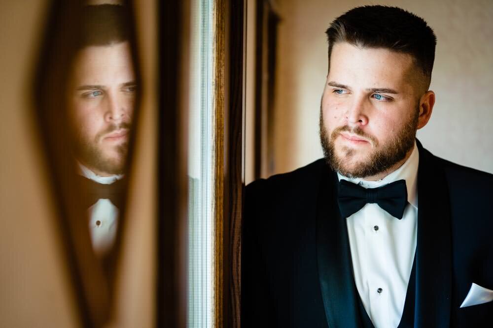  Creative groom portrait - Tapestry House winter wedding by Fort Collins wedding photographer, JMGant Photography 