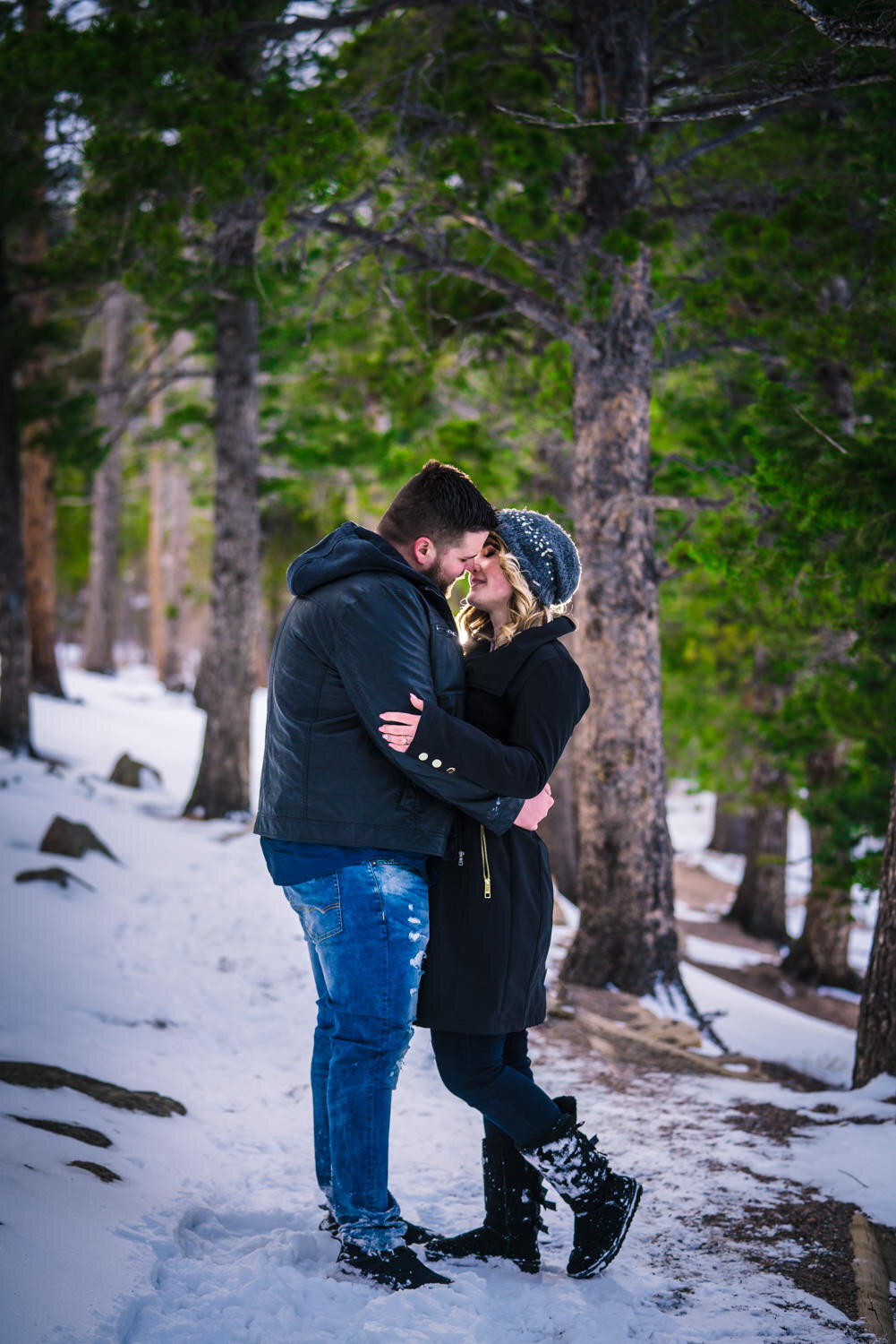  Snowy Estes Park Colorado engagement photos taken at Lily Lake in Rocky Mountain National. Photographed by JMGant Photography. 