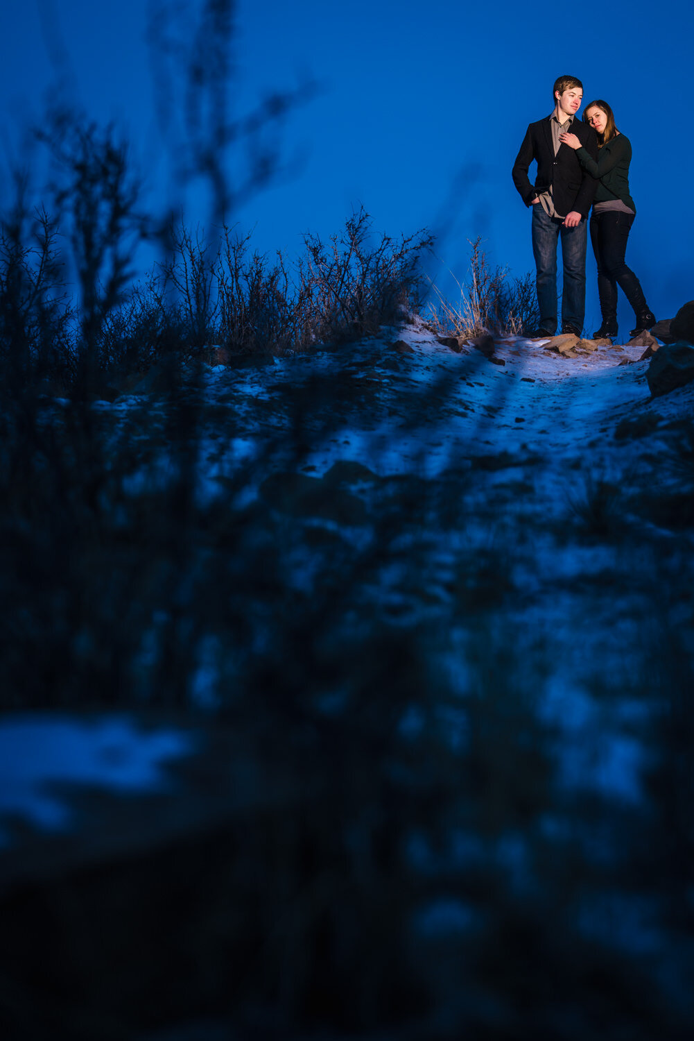  Winter snowy engagement pictures taken at the Horsetooth Reservoir in Fort Collins Colorado. Photographed by JMGant Photography. 