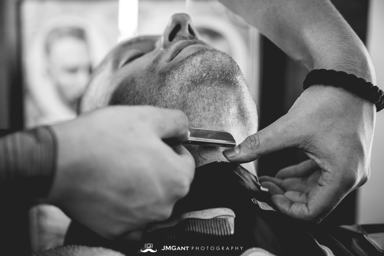  Groomsmen getting ready at the barborshop. 