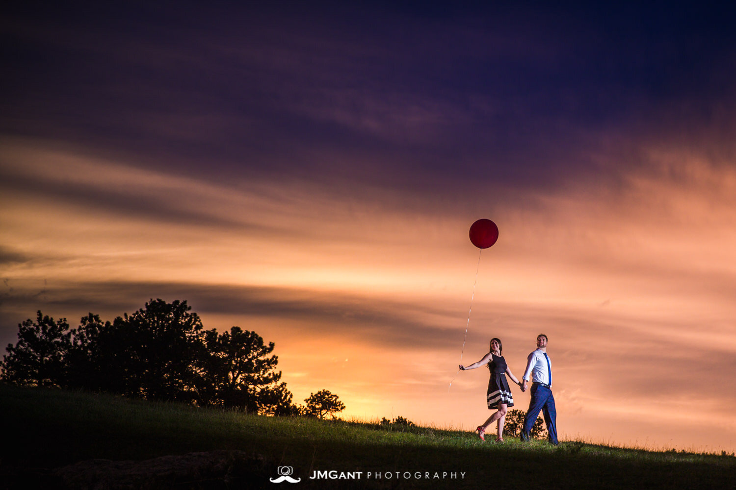  Incredibly colorful sunset at Rocky Mountain National Park during gorgeous Engagement Photography by JMGant Photography. 
