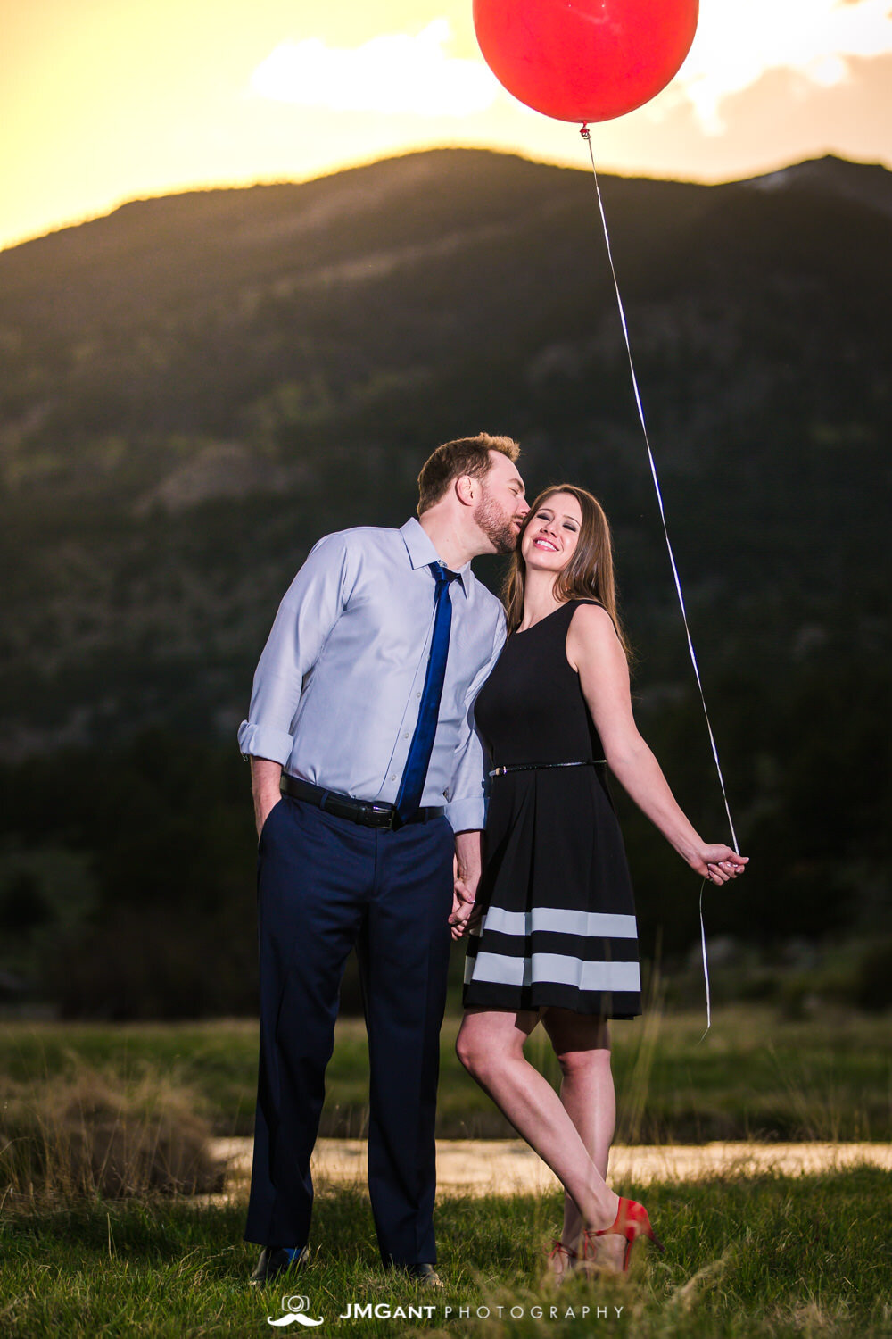  Incredibly colorful sunset at Rocky Mountain National Park during gorgeous Engagement Photography by JMGant Photography. 