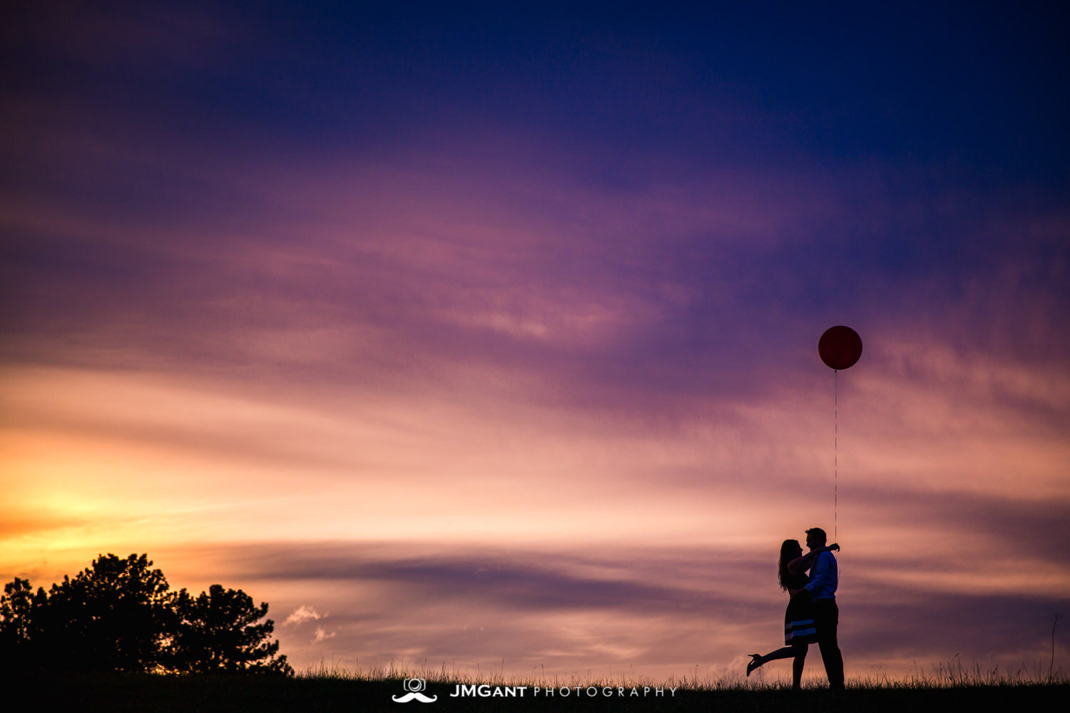  Incredibly colorful sunset at Rocky Mountain National Park during gorgeous Engagement Photography by JMGant Photography. 