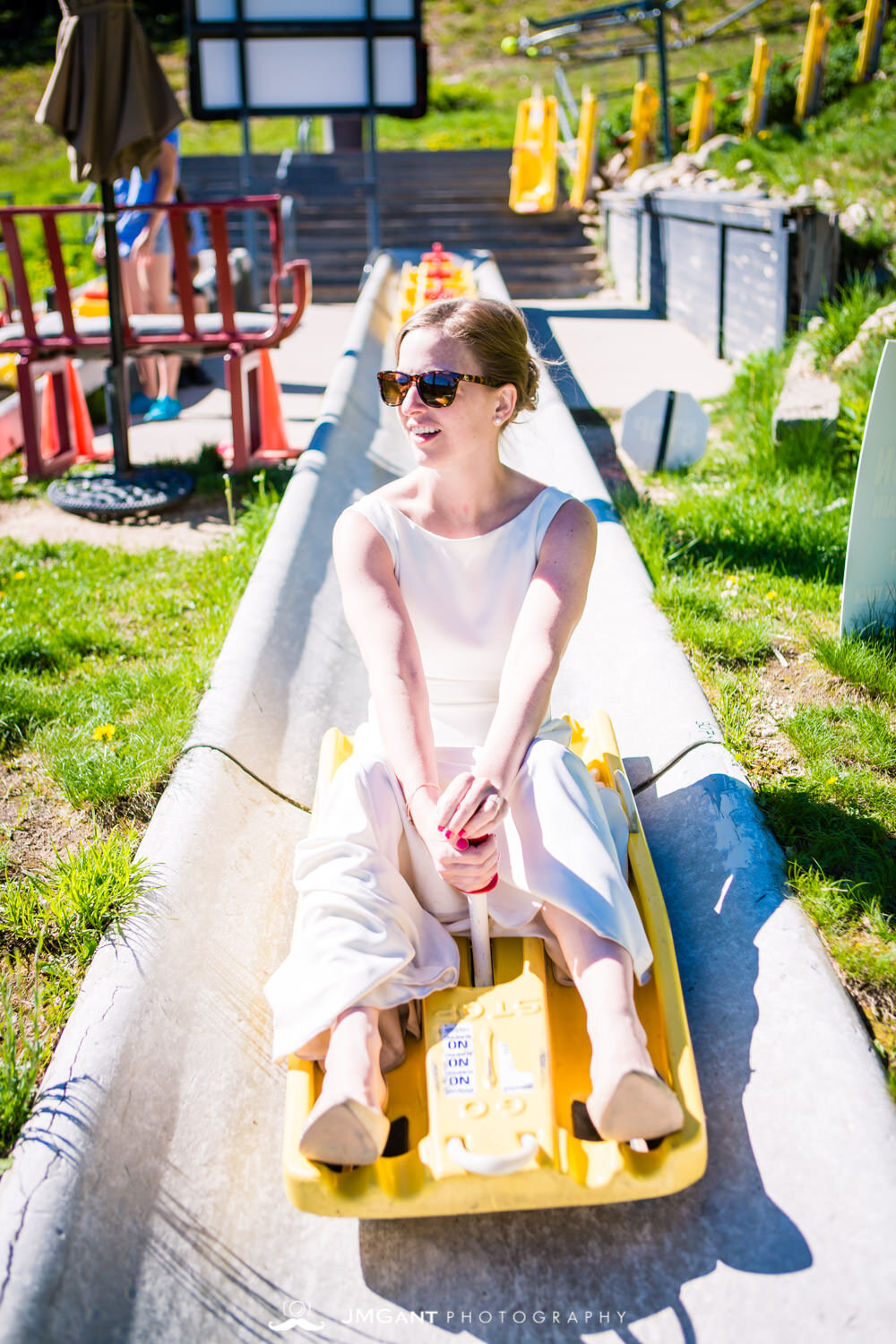  Bride and groom riding down the Winter Park Alpine Slide.&nbsp; 