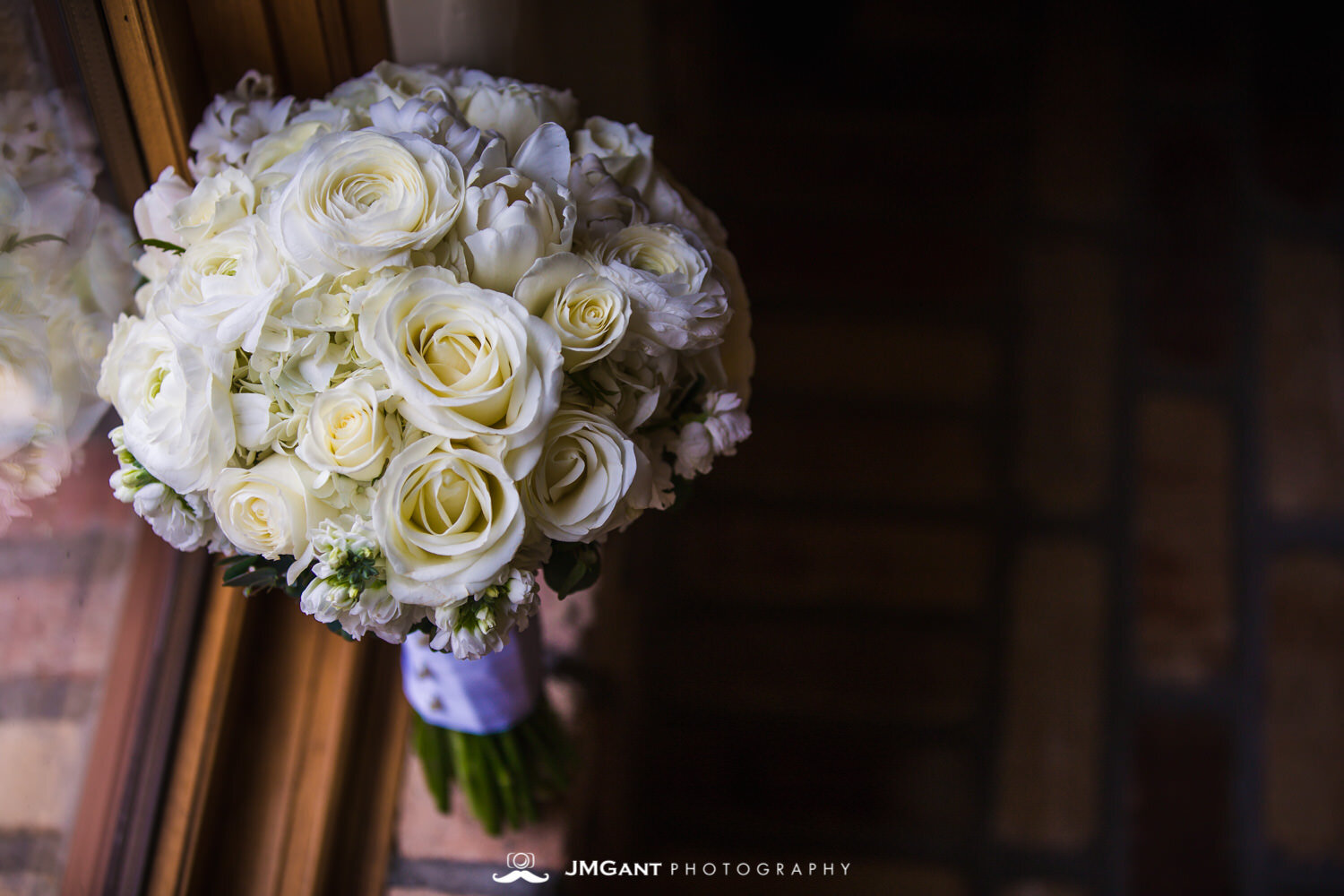  Bridal bouquet by floral designs of europe at an elegant wedding at the Della Terra Mountain Chateau in Estes Park Colorado. Photographed by Jared M. Gant of JMGant Photography. 