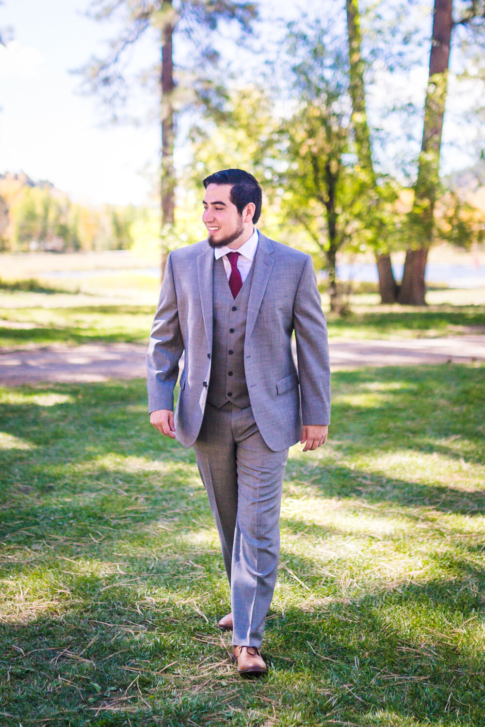  Groom in gray suite by JMGant Photography. 