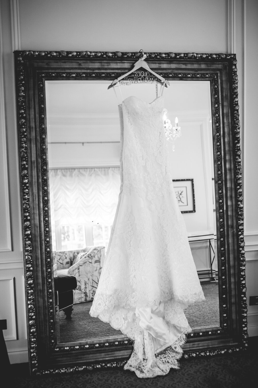  Wedding dress hanging on mirror.&nbsp;Photographed by JMGant Photography, Denver Colorado wedding photographer.&nbsp; 