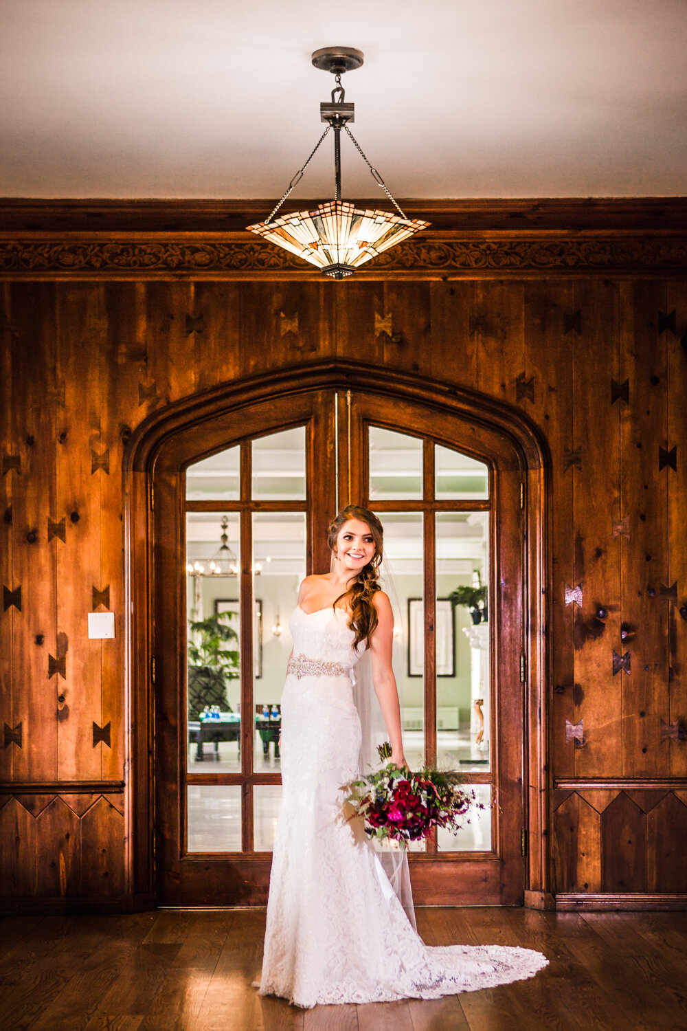  Bride in front of wood doors at Highlands Ranch Mansion. Photographed by JMGant Photography. 