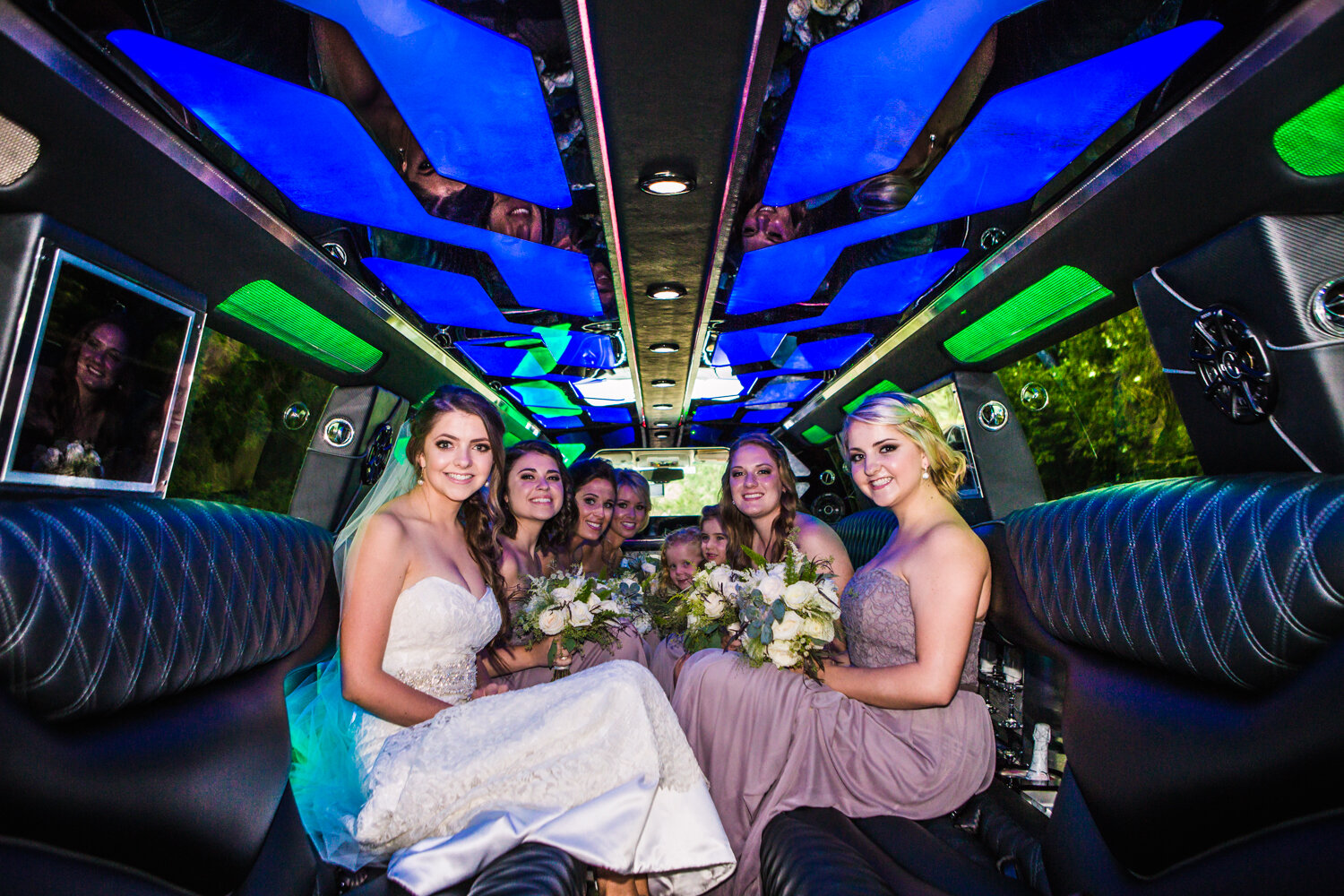  Bridal Party inside a stretch Hummer limo. Photographed by JMGant Photography 