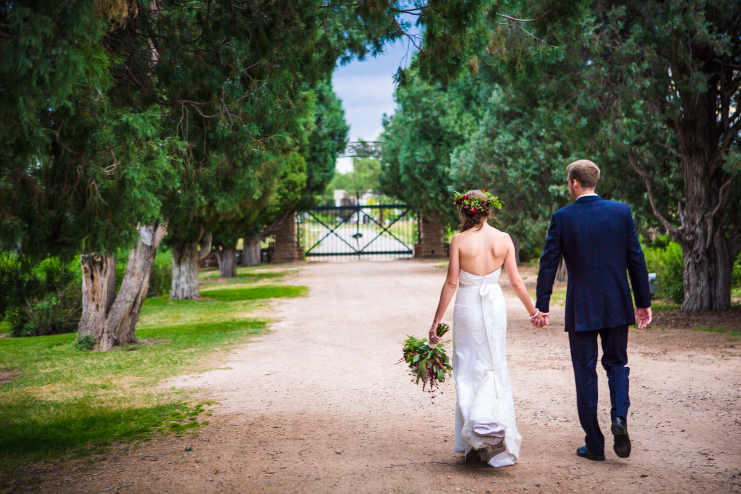  Bride and groom walking outside Highlands Ranch Mansion.&nbsp;&nbsp;  hotographed by JMGant Photography, Denver Colorado wedding photographer.&nbsp; 