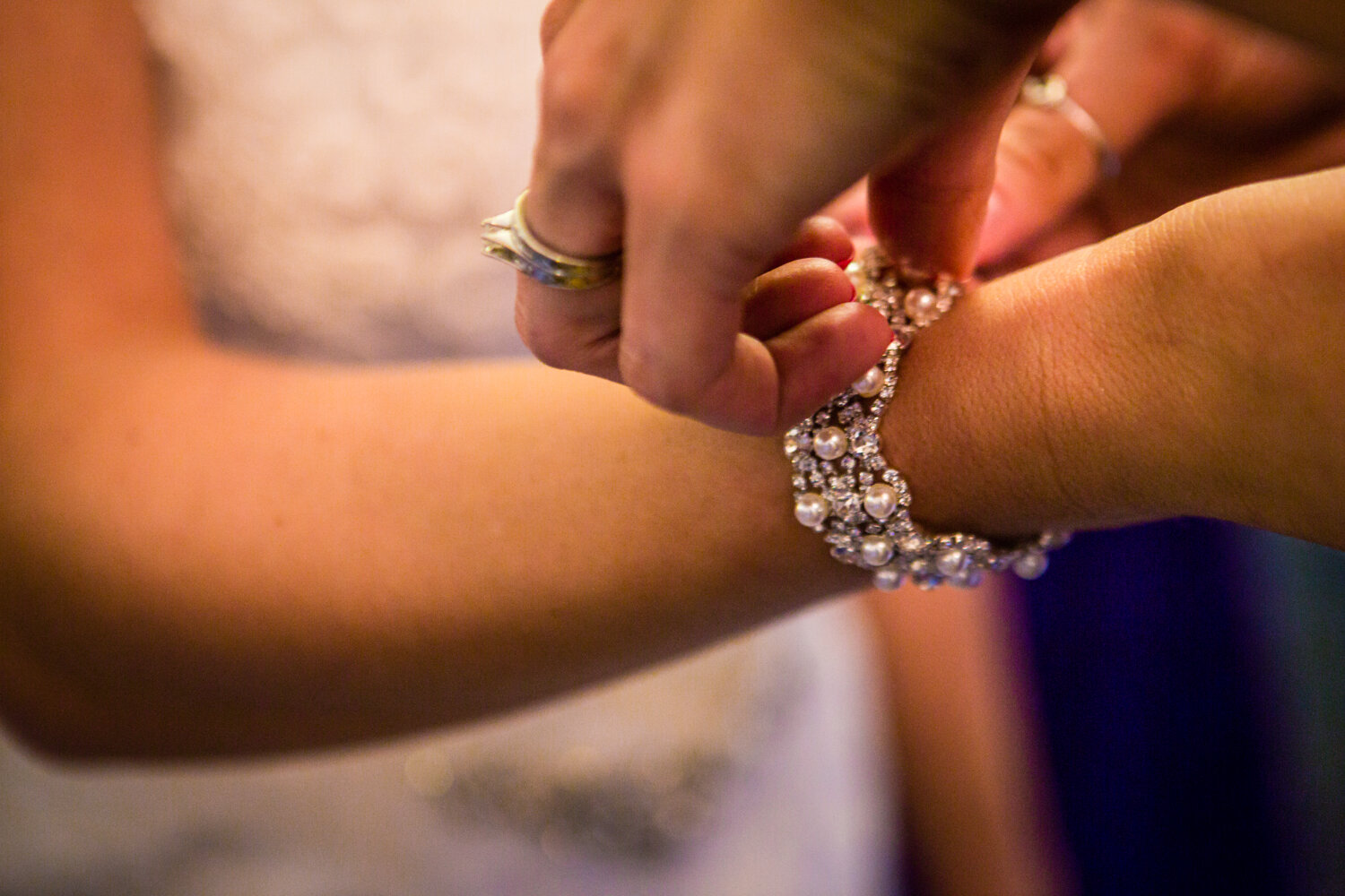  Bride putting her jewelry on.&nbsp;The barn at Evergreen Memorial. Photographed by JMGant Photography. 