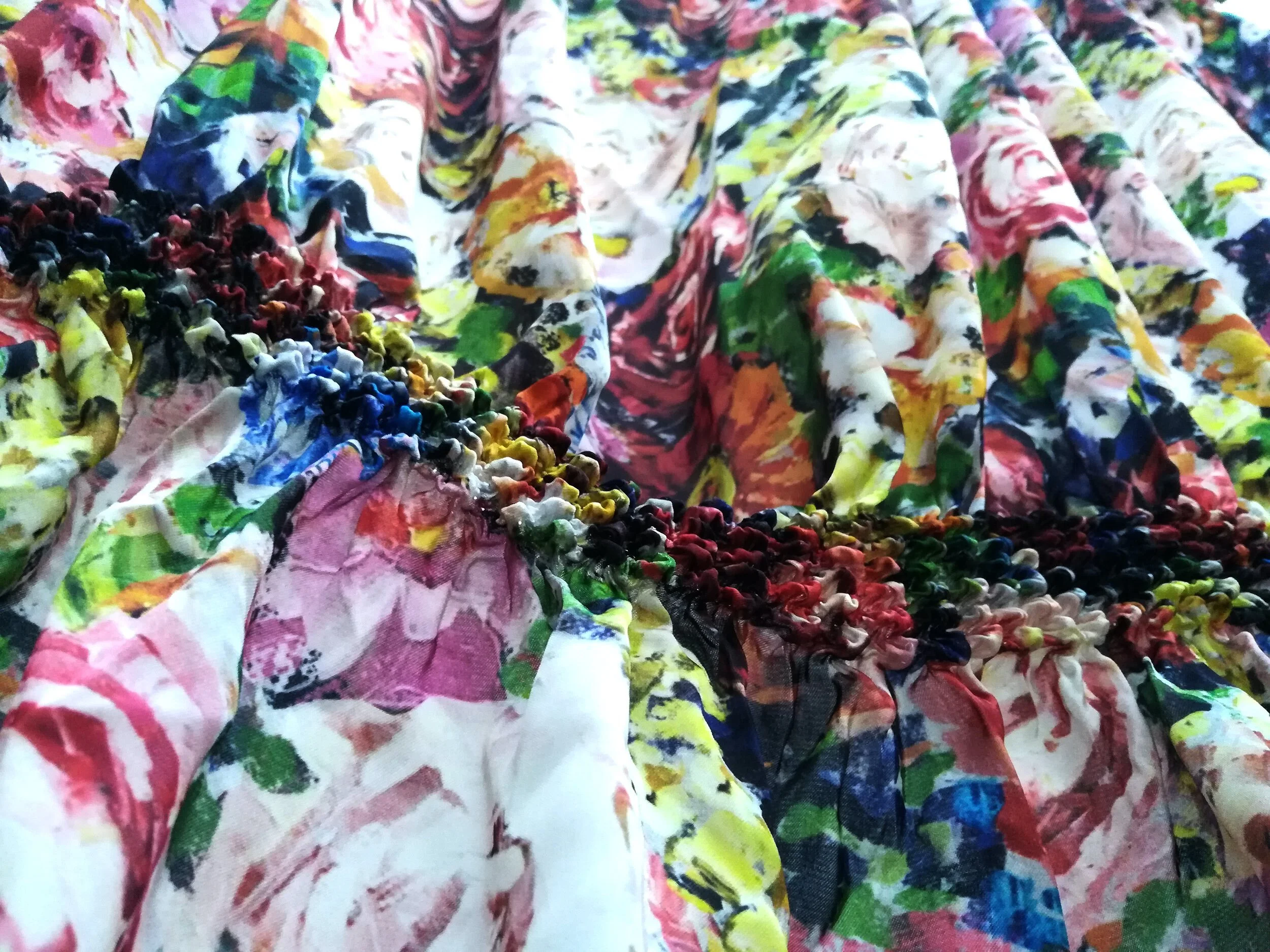 Signature style Shibori on an oil painting flower print.
Shibori in the Shape Making Strategy. JUN NAKAMURA.