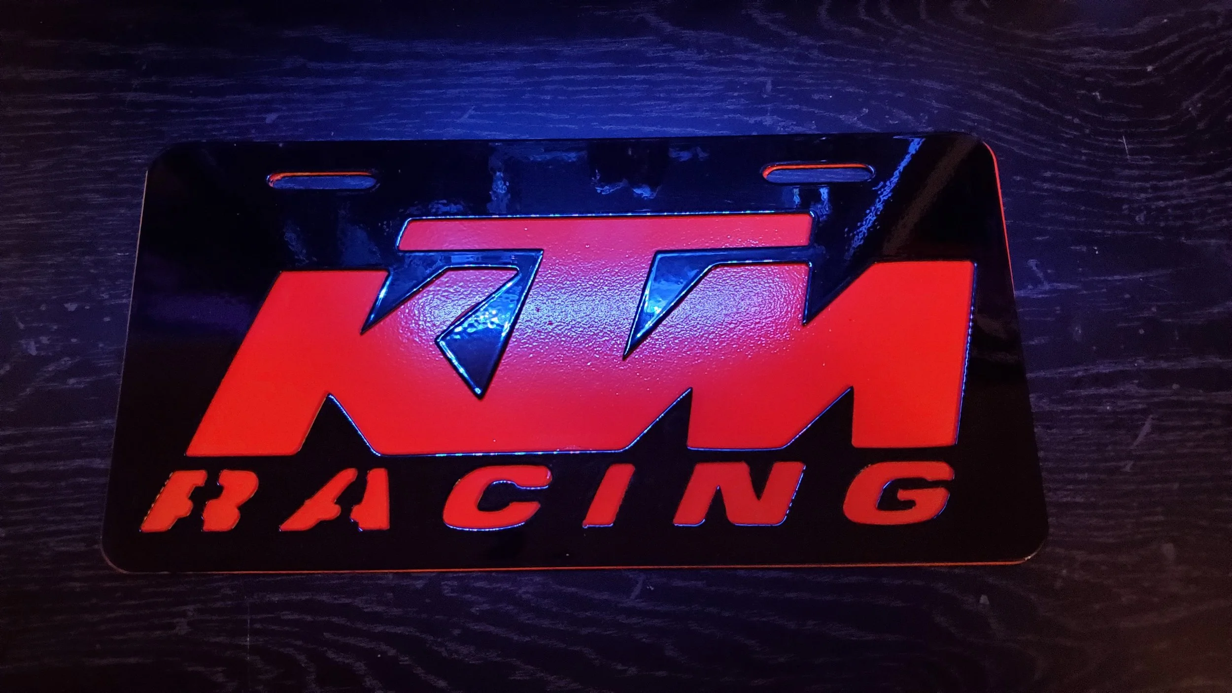 KTM Racing logo on a black background with red lettering