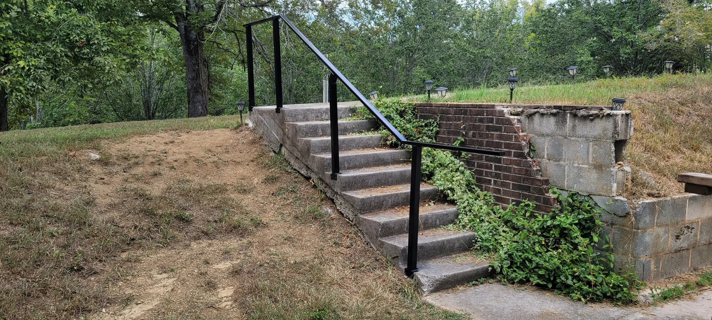 Custom steel handrail and railing system fabricated in Tellico Plains TN by Turn 2 Customz