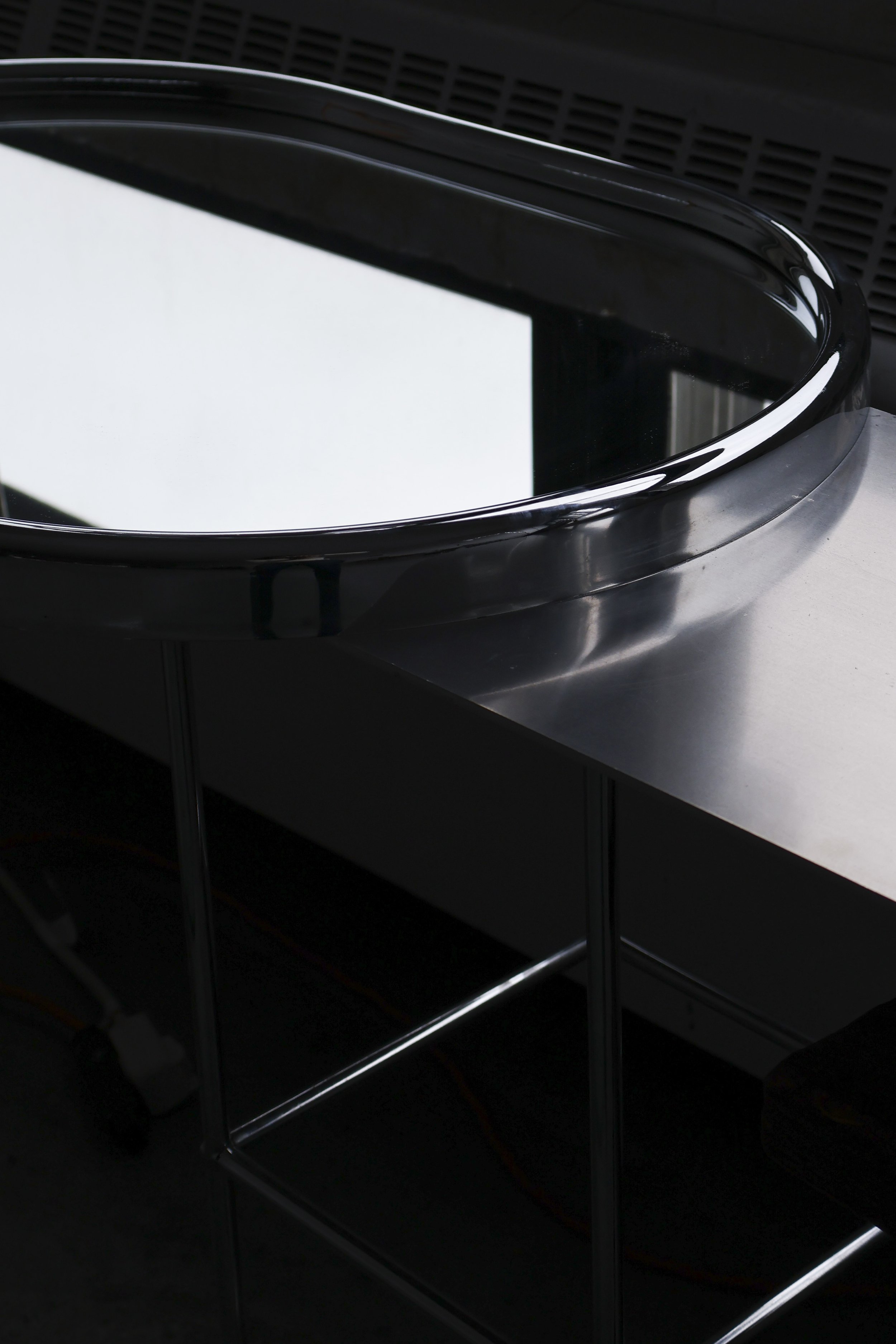 Large 1970s oblong wall mirror with minimalist chromed plastic edge.