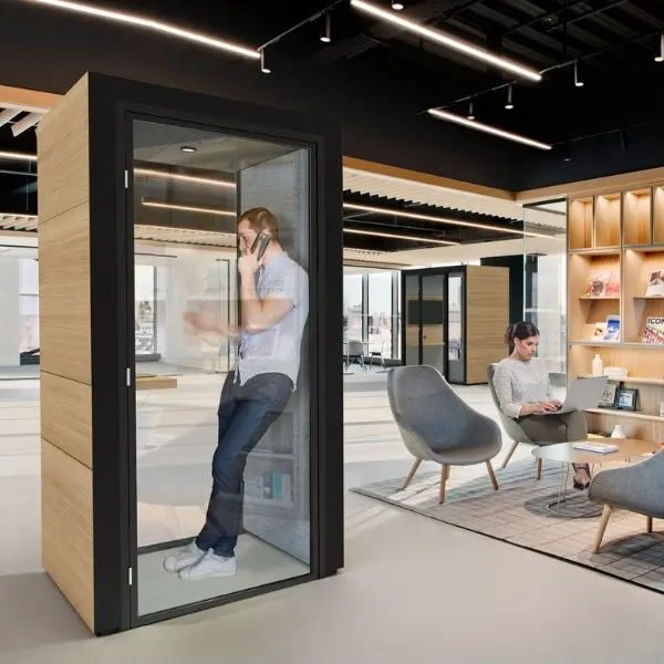 Sustainable office interior combining natural materials, plants and a modular Eco Pod.