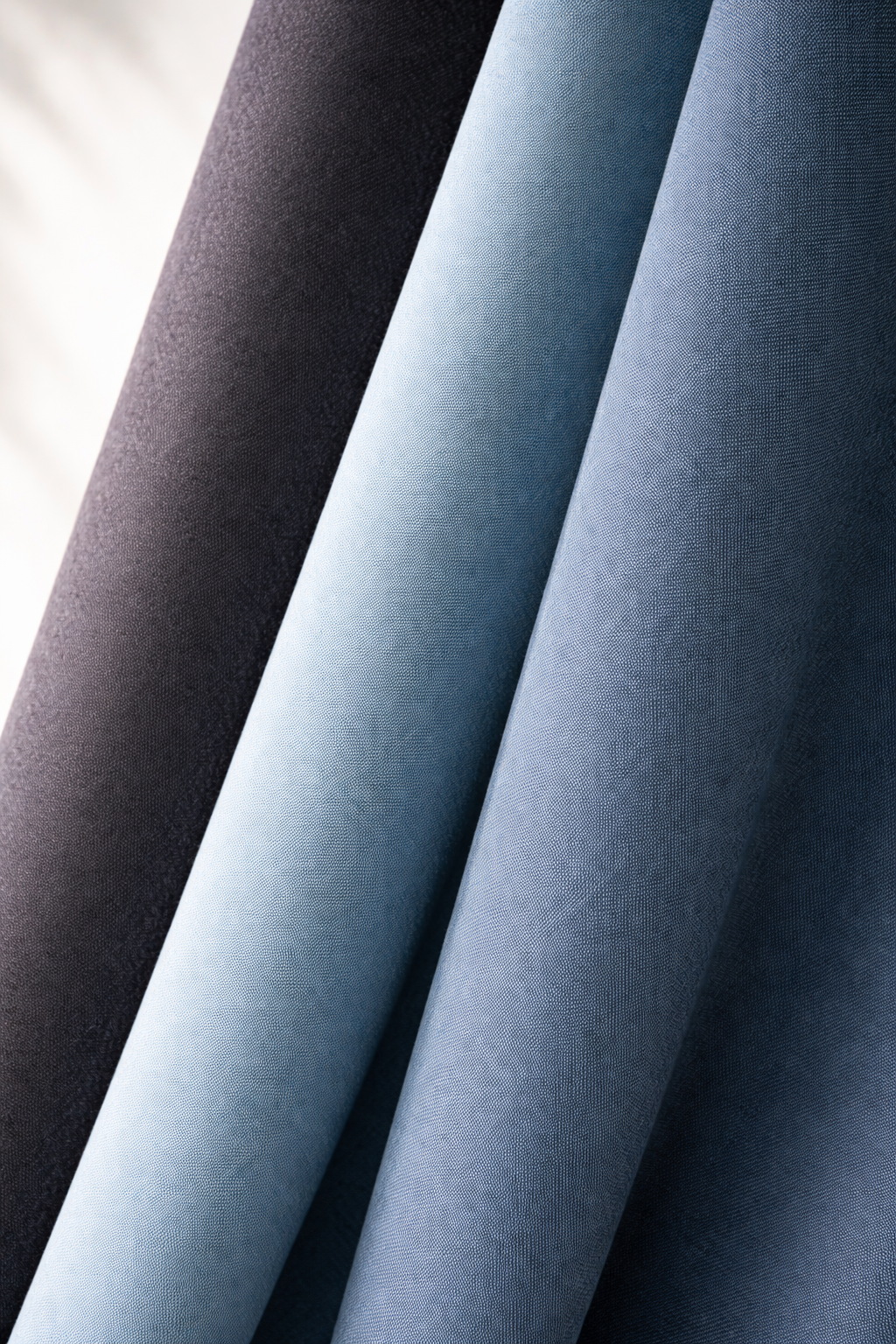 Smooth Pure upholstery material in dark grey and blue tones.