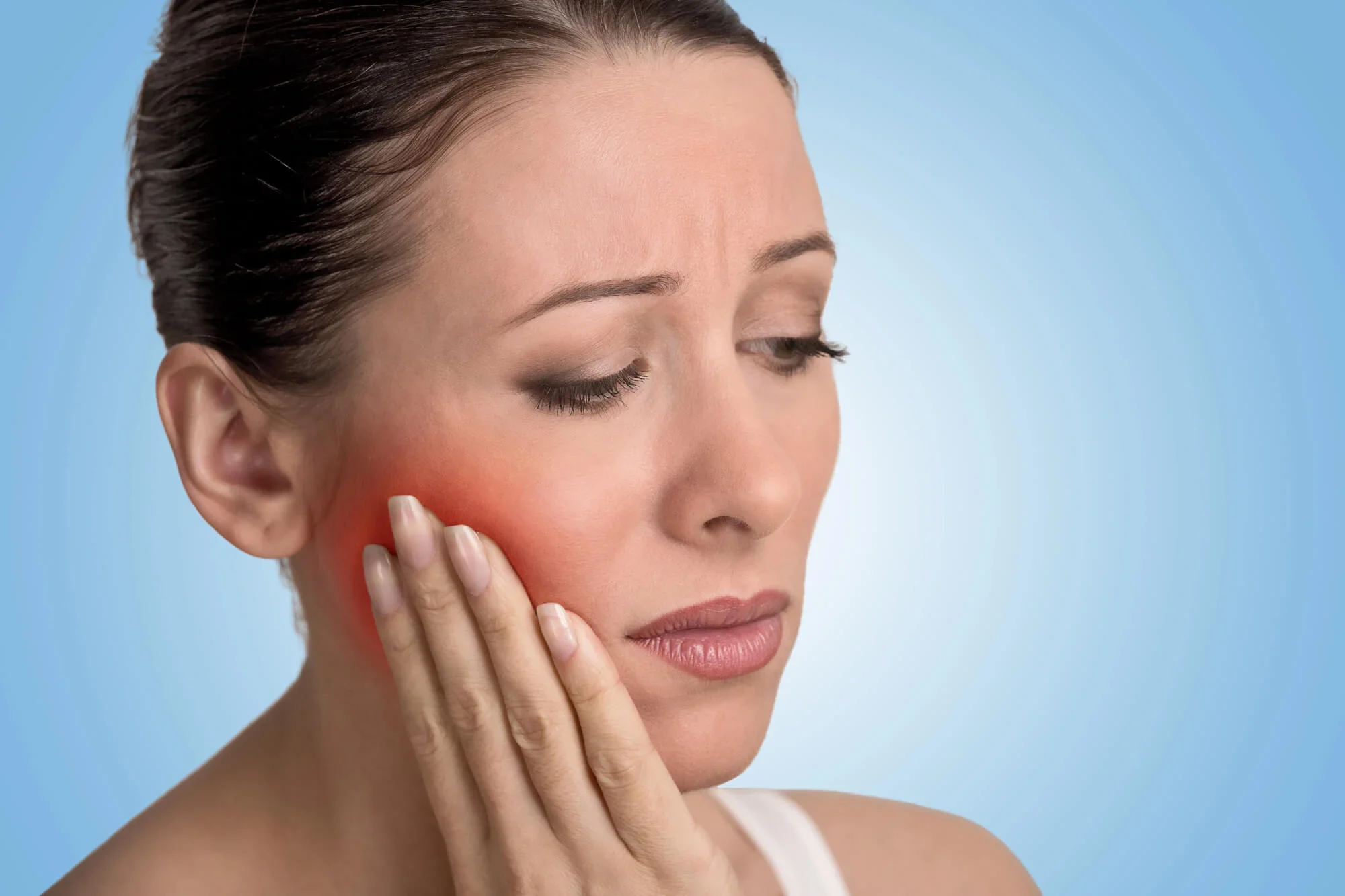 Woman experiencing dental pain in Panama City, FL.