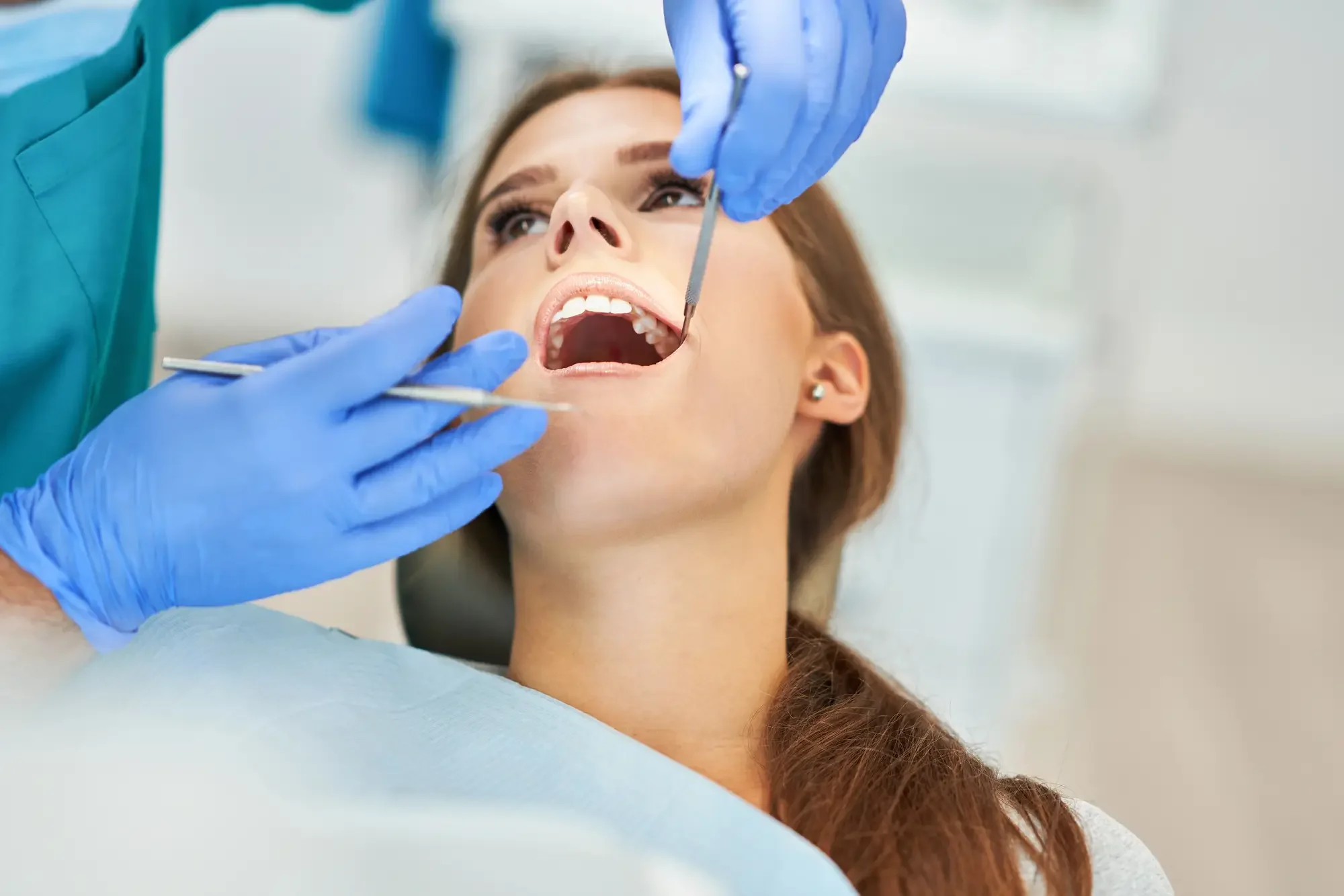 Emergency dentist Lynn Haven with male dentist and woman in office