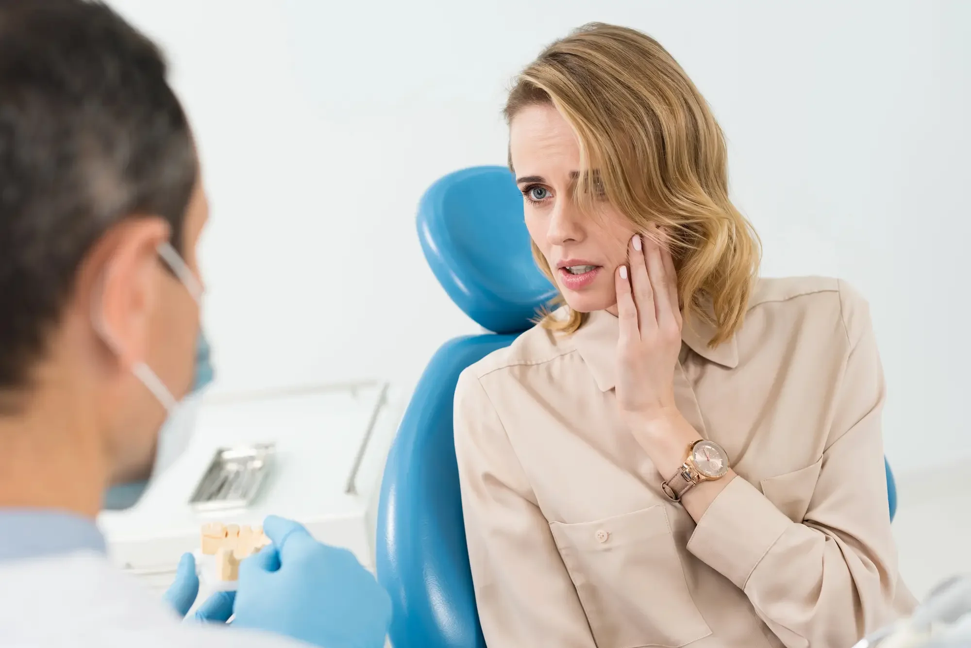 Emergency dentist Lynn Haven helping female patient with toothache