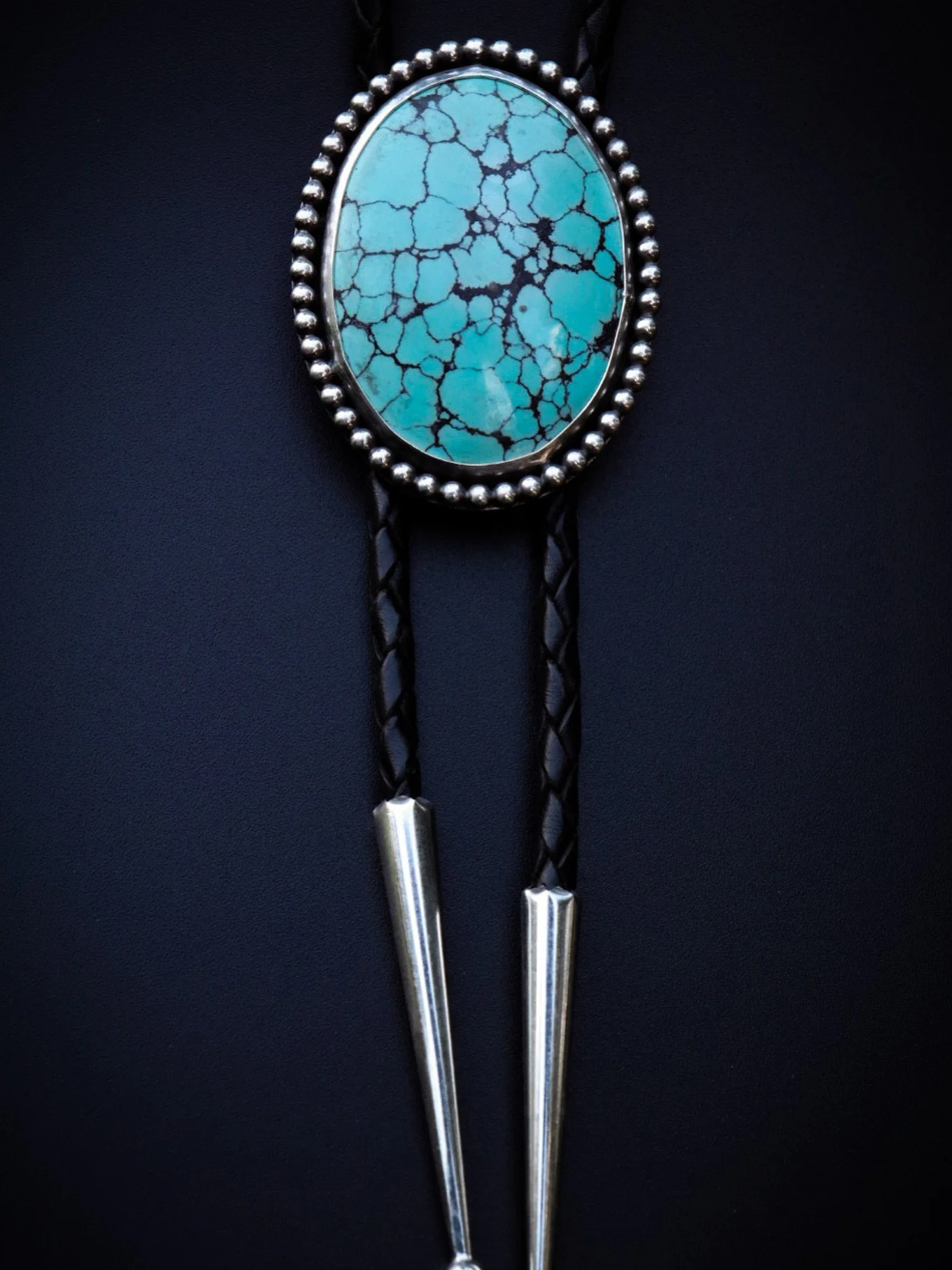 Spotlight on this big beautiful turquoise bolo that found it&rsquo;s home at @kentucky.punkrockfleamarket last weekend! 🖤
.
.
.
.
.
.
.
#handmadebolo #bolotie #silverbolo #silversmith #silversmithing #handmadejewelry #ooakjewelry #statementjewelry #