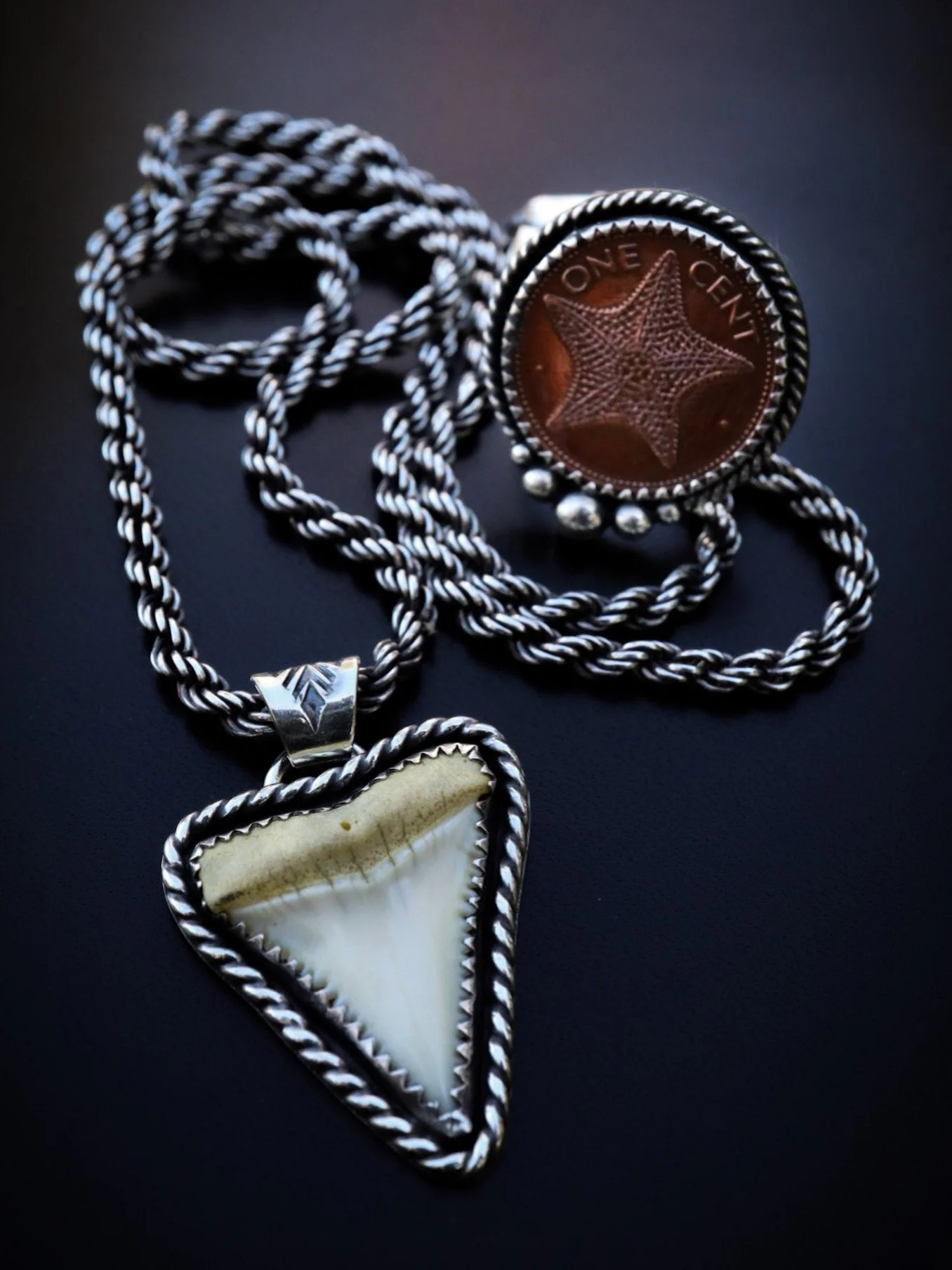 A matching his and hers set I made for a client recently - featuring a one cent coin from the Bahamas and a shark tooth he found while working on a fishing pier 45 years ago. It&rsquo;s so fun to take found objects with memories and transform them in