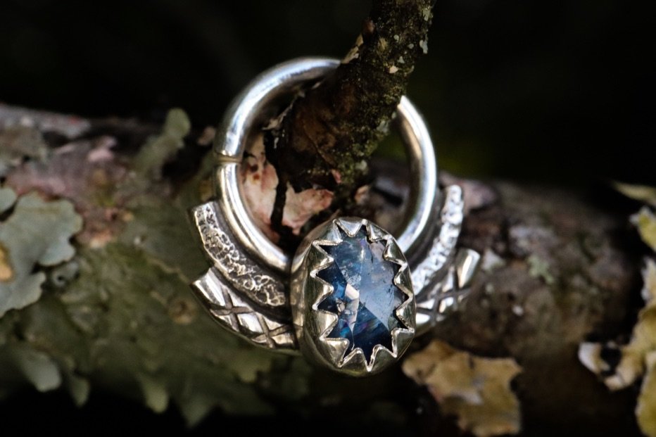 Back at it after being away from the bench for awhile. It feels so good to be working with silver again and creating something beautiful. This is a rose cut sapphire &ldquo;septum&rdquo; ring - it can be worn in other piercings too - handmade with fi