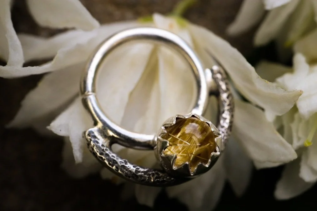 Golden rutilated quartz septum ring coming with me to @yallmartsc tomorrow! This hoop can also be worn in other piercings, it&rsquo;s 16 gauge with a 10mm diameter and an 8mm wearable area. Handmade with fine and sterling silver. I gave this one a su