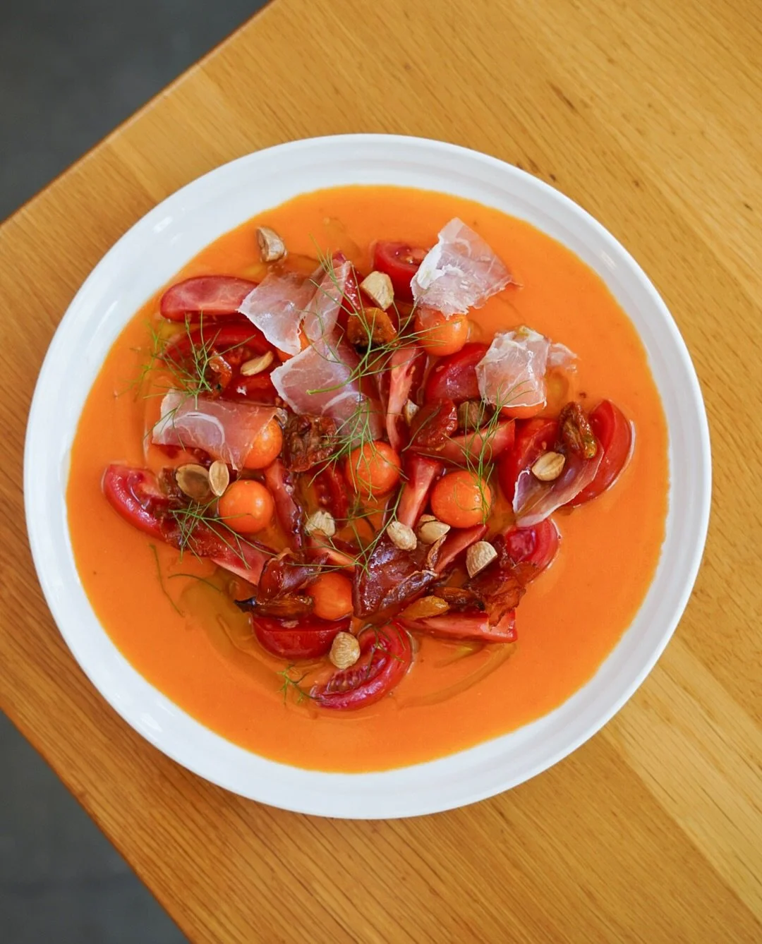 their peak right now, running strong through October and into November.
&nbsp;
This dish celebrates the season with tomatoes four ways: fresh Campari and Sungolds, slow-confit cherry tomatoes, and a silky salmorejo. Any eagle eyed followers might rem