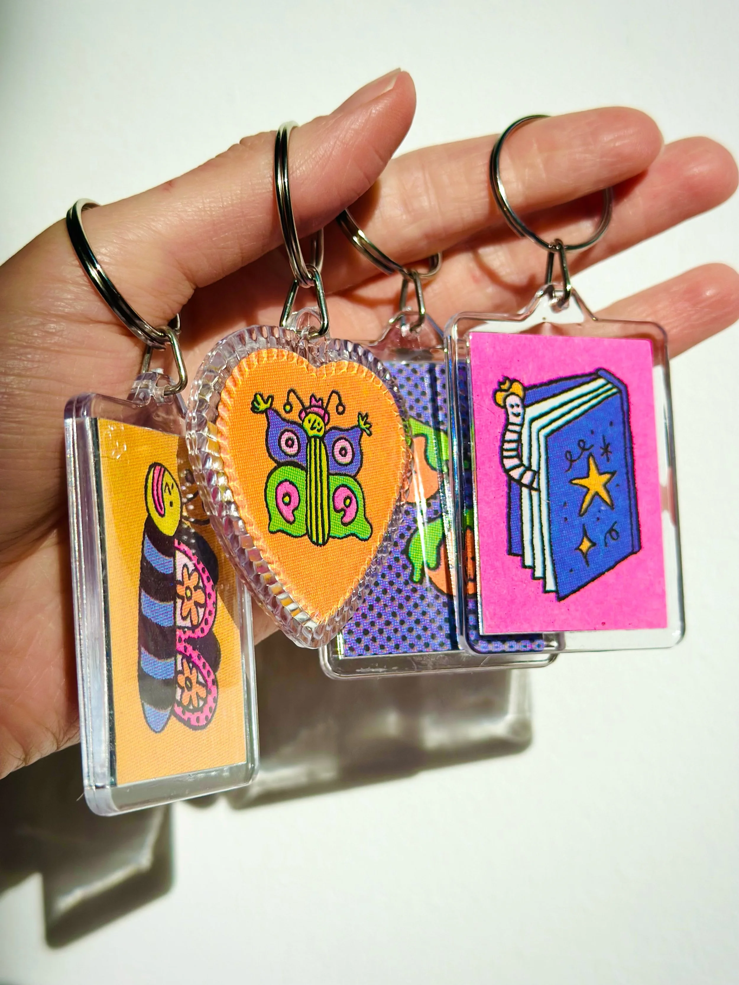Four colour riso keychains launching at @shakebristol this Saturday!

I&rsquo;ve been working on these, on and off since January. Eventually I narrowed it down to 16 double sided tiny illustrations and it was haaard! I&rsquo;m so happy with how they 
