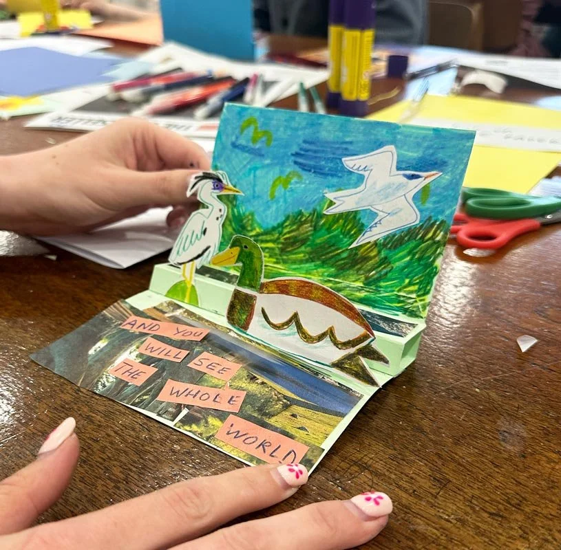 Participants creating paper pop-up illustrations during a family art workshop in Glasgow. Classes led by the illustrator Jagoda Sadowska.
