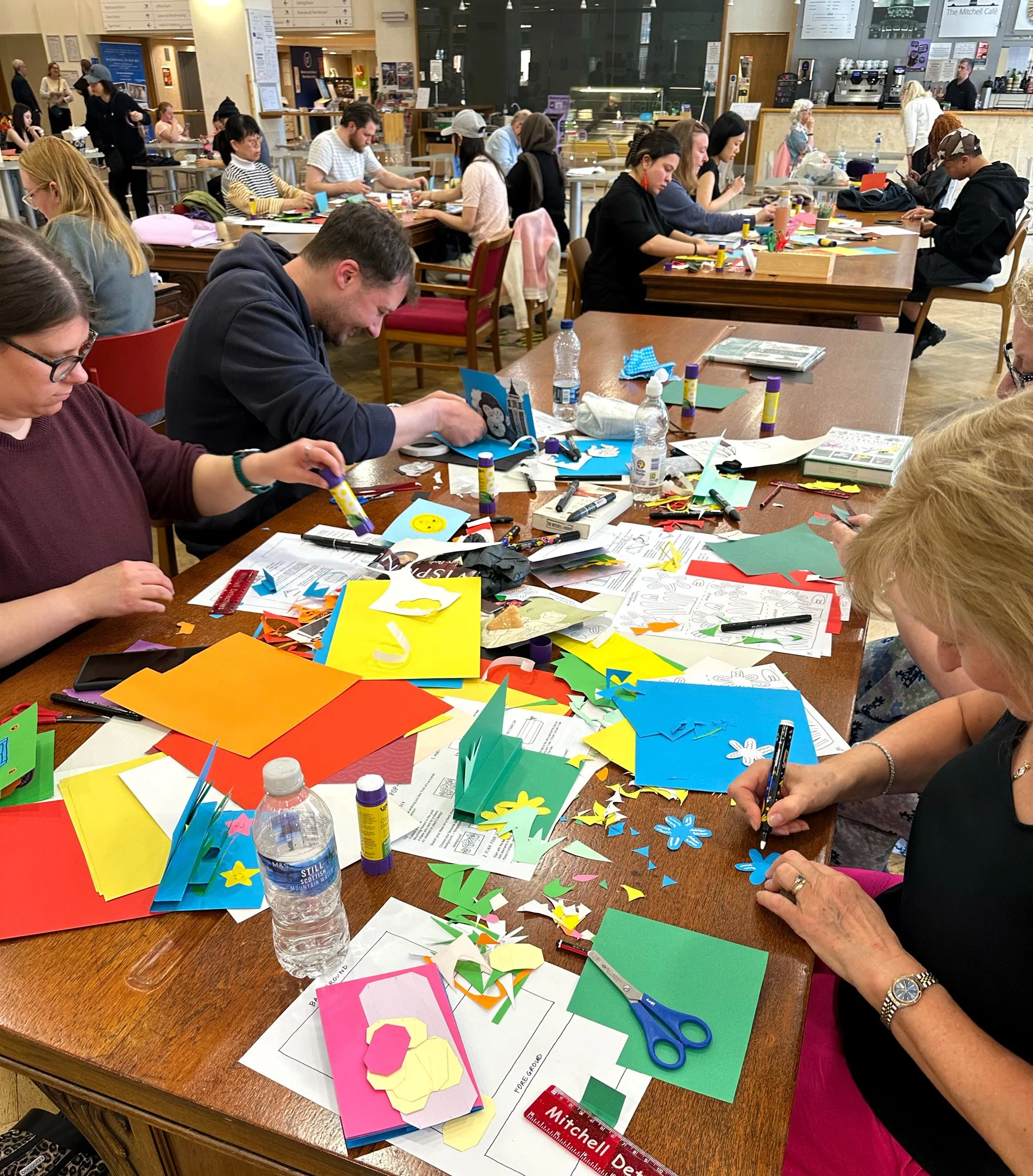 Participants creating paper pop-up illustrations during a family art workshop in Glasgow. Classes led by the illustrator Jagoda Sadowska.