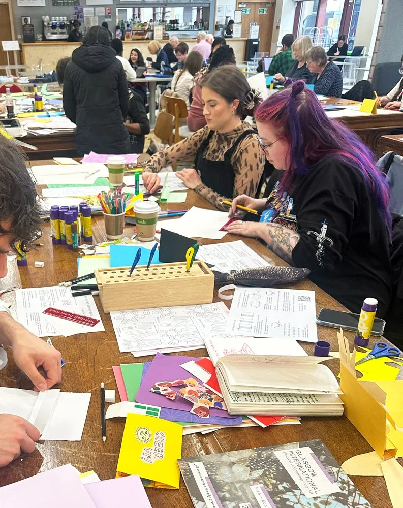 Participants creating paper pop-up illustrations during a family art workshop in Glasgow. Classes led by the illustrator Jagoda Sadowska.