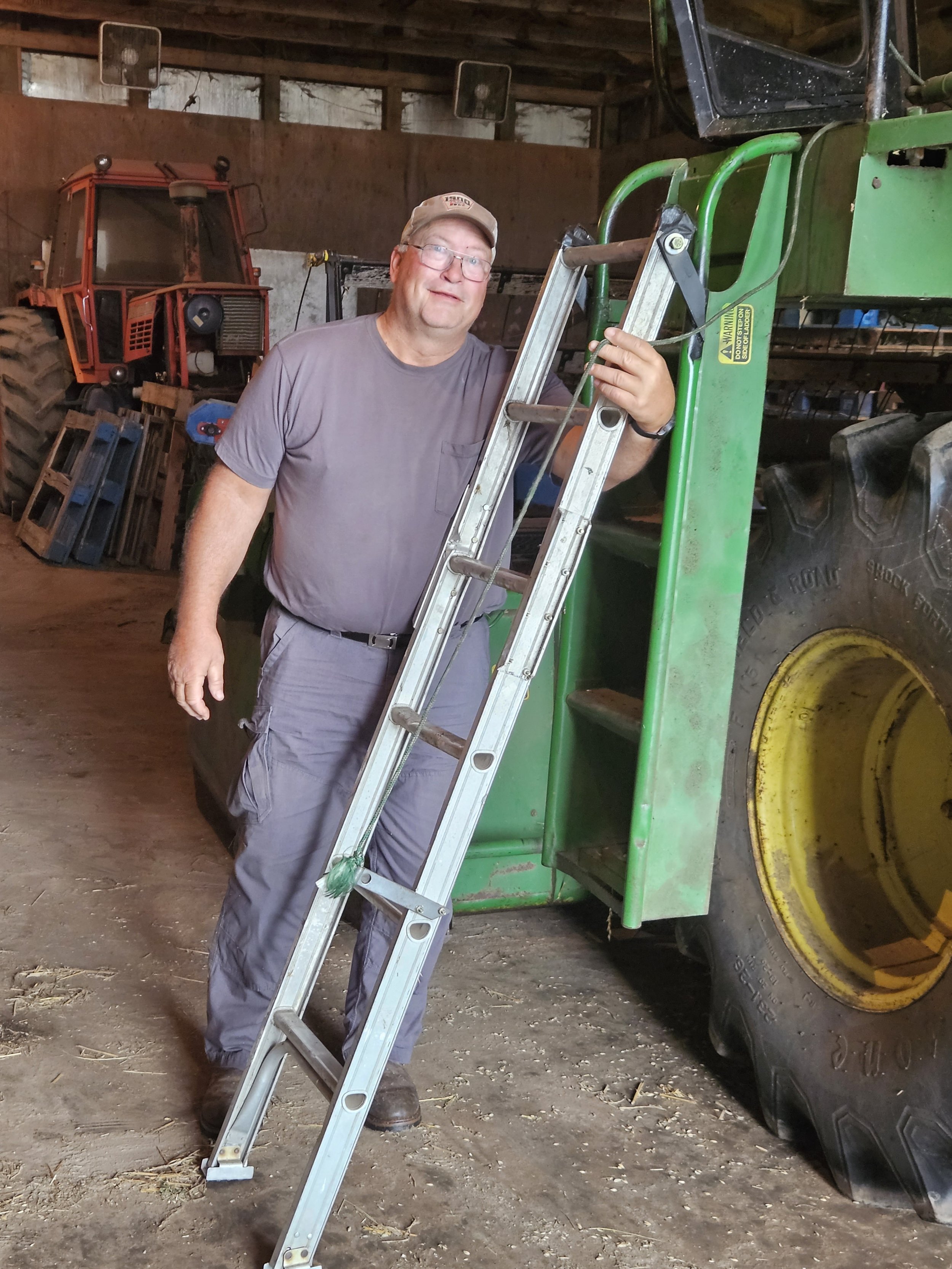   Simple and effective, Glen has created his own assistive technology to help him enter his combine easier. Once on the combine platform, he can pull up the ladder and attach it to the existing ladder while working in the field.  