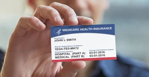 man-holding-medicare-card-480x250.jpeg