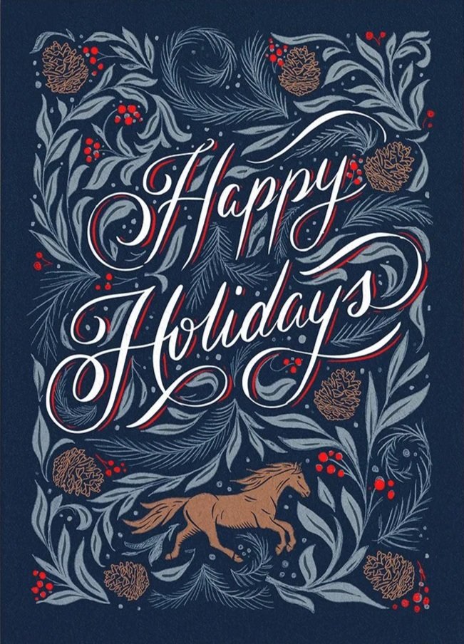 Greeting card on a dark navy reads "Happy Holidays" in a calligraphic hand lettered style, surrounded by hand drawn winter botanicals and a galloping horse at the bottom