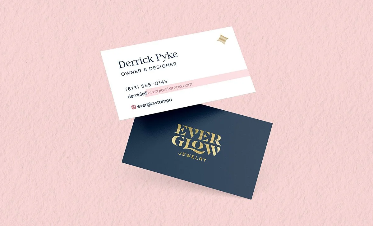 business card concept floating on a pink background with gold metallic logo