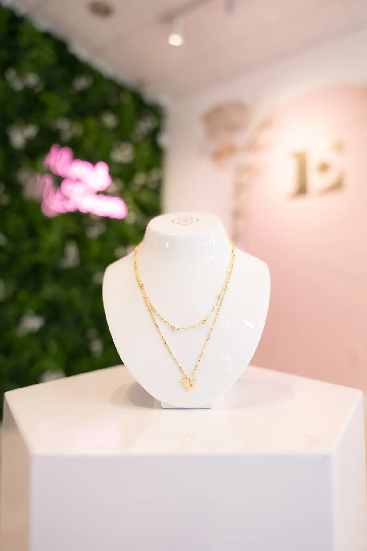Everglow Jewelry store interior with manakin wearing gold necklace