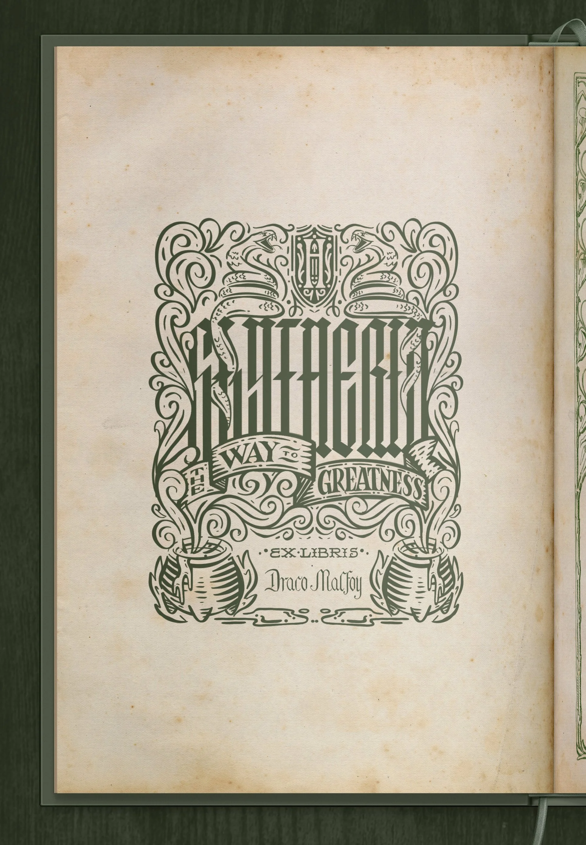 Open book with an ornate cover featuring detailed black line art of snakes and cups, hand lettering reading 'Slytherin'  'Way to Greatness,' and 'Ex Libris' and the name 'Draco Malfoy' at the bottom.